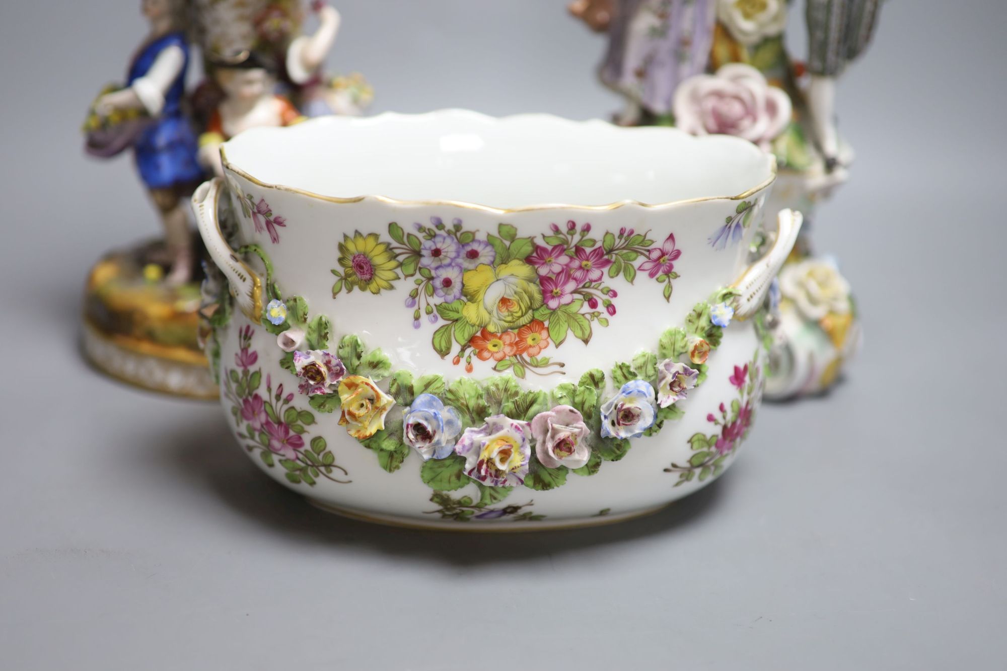 A Potschappel porcelain figural lamp, another similar lamp and a Dresden bowl with swags of flowers, tallest 28cm